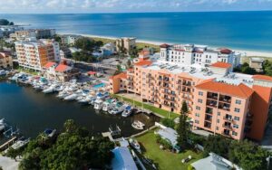 aerial view of mediterranean style hotel with beach and marina at madeira bay resort st pete