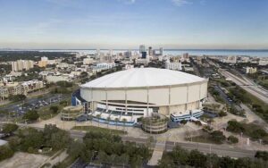 aerial view of white domed stadium with cityscape and bay at tropicana field st pete