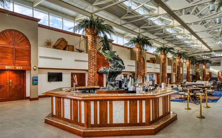 atrium lobby restaurant area with statues at island grand resort st pete beach