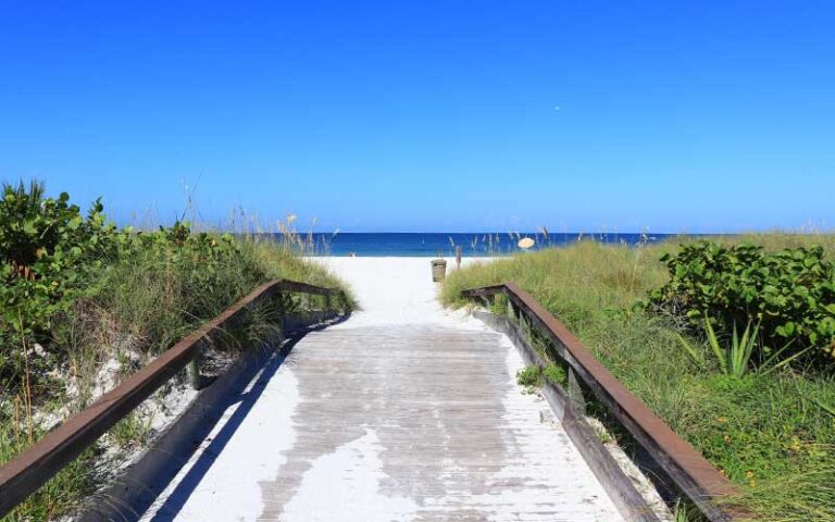 beach access point with boardwalk ramp over dunes at st pete beach
