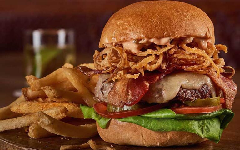 burger with onion crisps at the edison at disney springs orlando