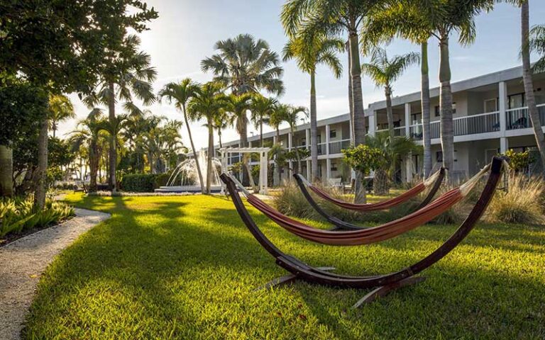 courtyard lawn with hammocks and fountain at the beachcomber st pete beach