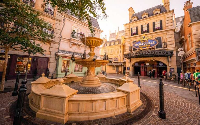 courtyard with fountain and sign at remys ratatouille adventure at epcot walt disney world resort orlando