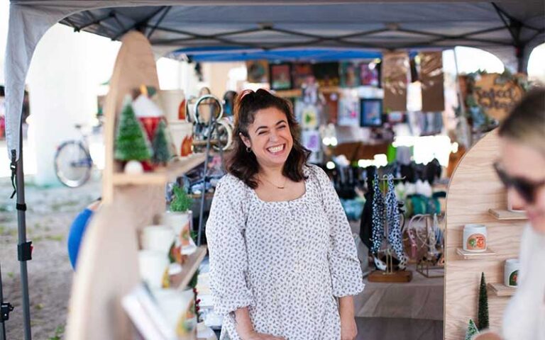 customers shopping jewelry booth at st pete indie flea