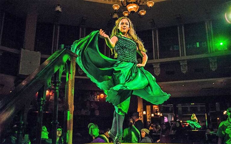 dancer in green dress on stage at raglan road irish pub at disney springs orlando