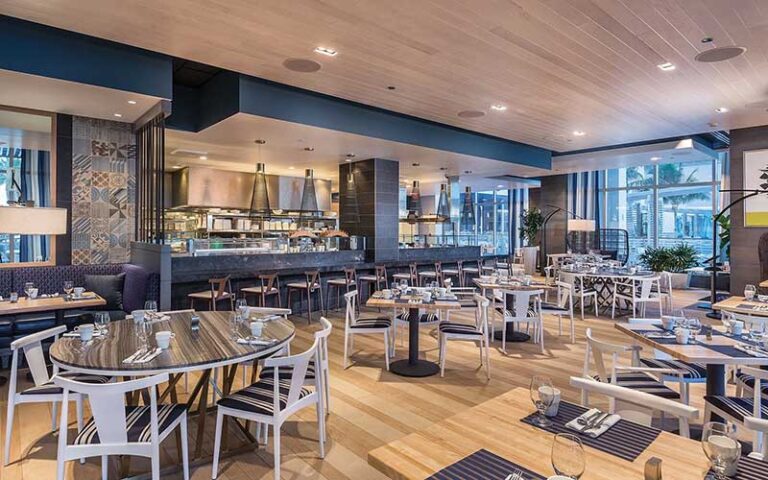 dining and bar area with blue accents at wyndham grand clearwater beach