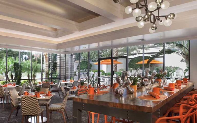 dining area with high windows and chandeliers at hilton st petersburg bayfront