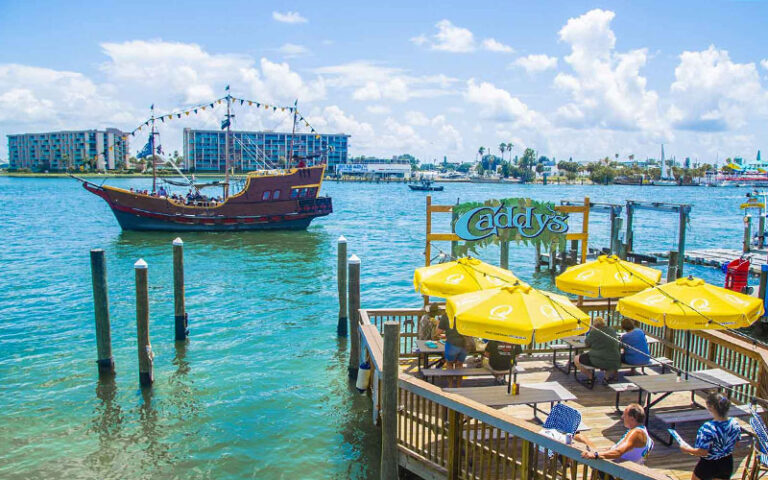 dining deck at caddys with inlet pirate ship at johns pass village boardwalk madeira beach