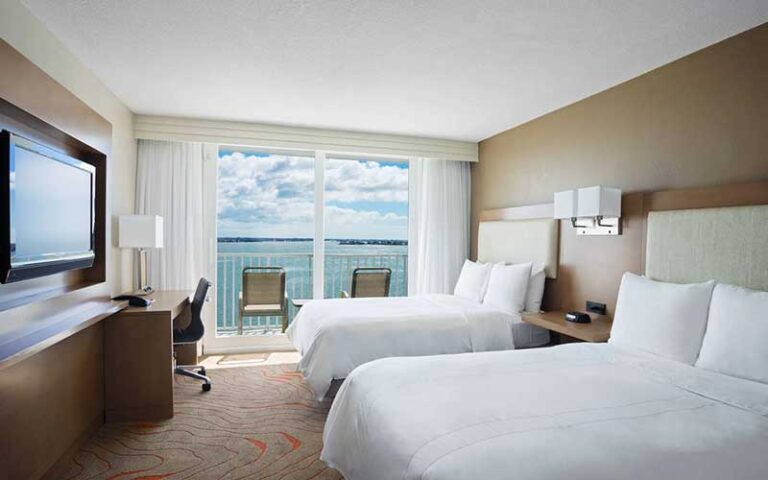 double queen bed guestroom with balcony bay view at clearwater beach marriott suites on sand key