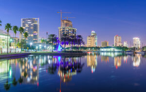 downtown night skyline from tampa bay high rise buildings and marina lights reflected st pete