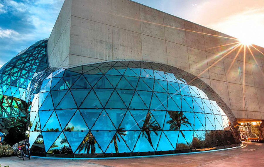 exterior of building with bubbled atrium glass and sun flare at the dali museum st pete