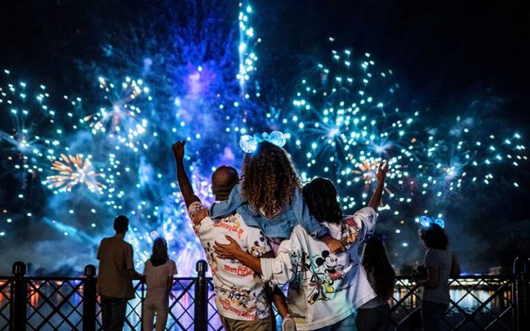 family cheering fireworks show world showcase at epcot walt disney world resort orlando