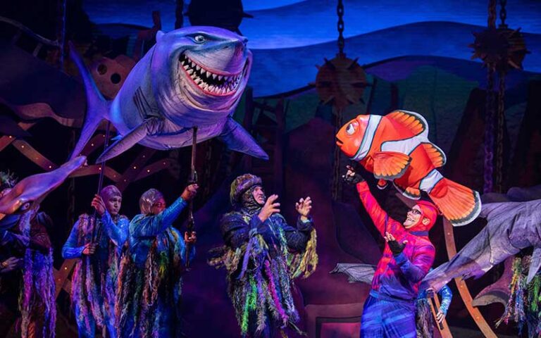 fish and shark on stage at finding nemo big blue beyond at animal kingdom walt disney world resort orlando