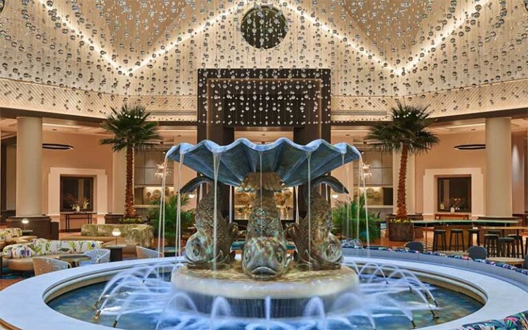 fish themed fountain in upscale lobby at walt disney world dolphin resort orlando