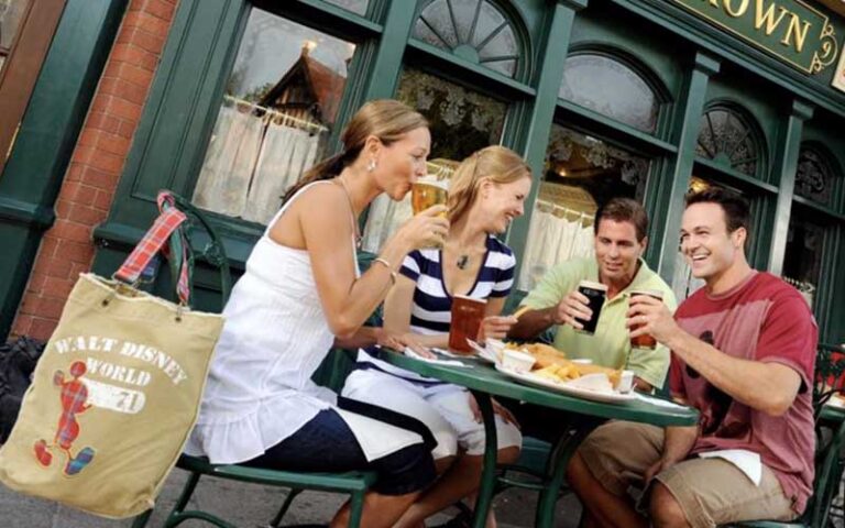 friends toasting beer at rose crown at uk pavilion world showcase at epcot walt disney world resort orlando