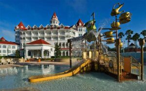 front exterior of hotel with pool and play area at disneys grand floridian resort spa walt disney world orlando