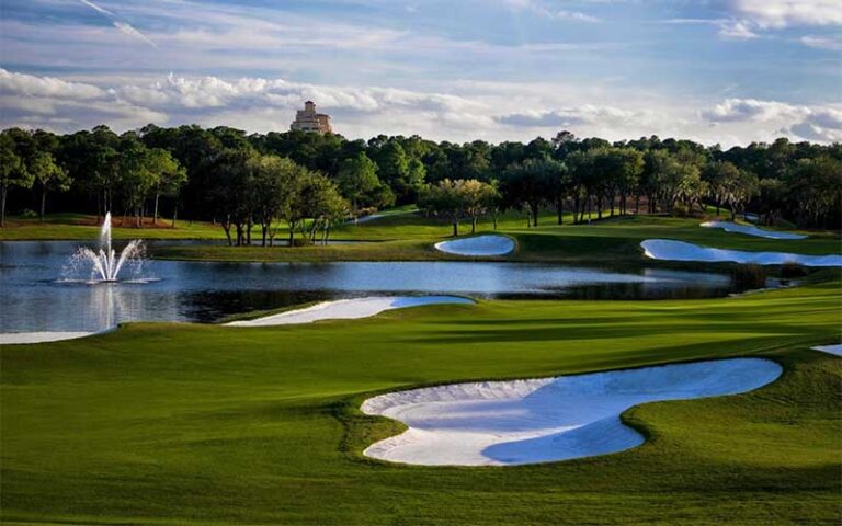 golf course with hotel in the distance at four seasons resort orlando walt disney world