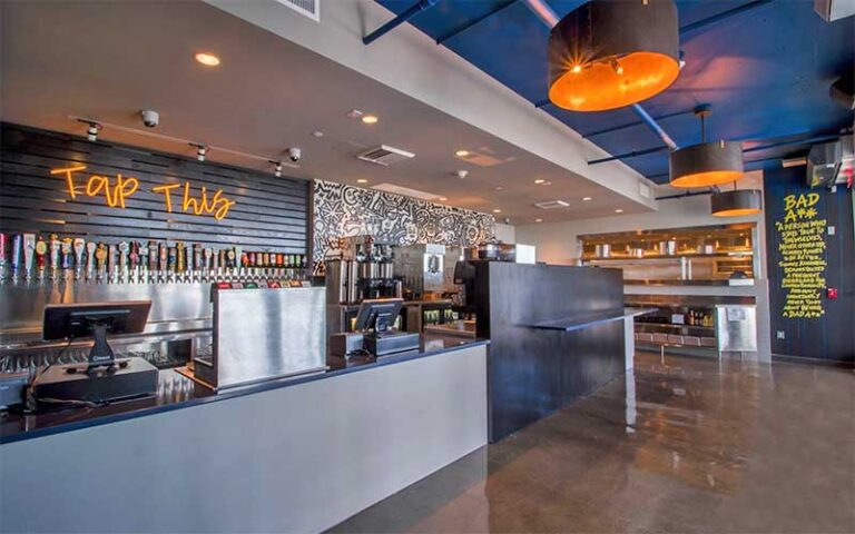 indoor bar area with wall of beer taps at badfins food drink clearwater beach