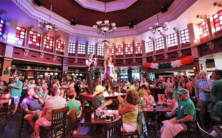 interior of dining area with centered stage at raglan road irish pub at disney springs orlando