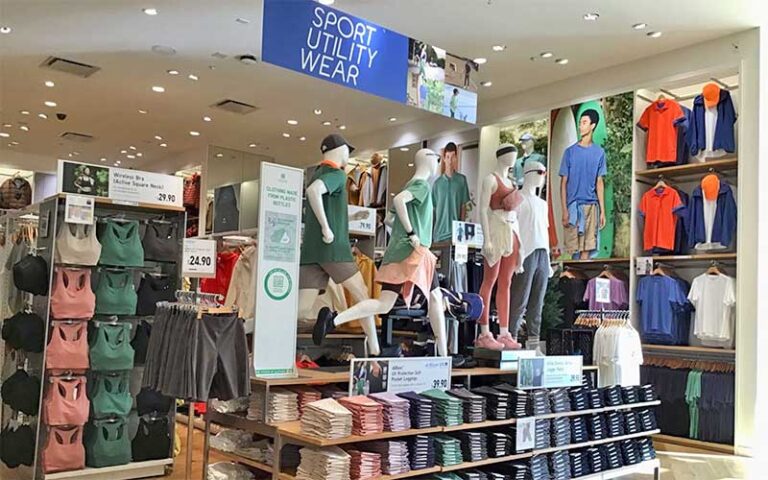 interior store racks with sport utility wear sign at uniqlo disney springs orlando