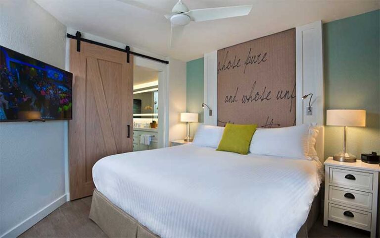 king size bed in suite bedroom at beach house suites st pete