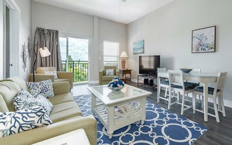 living room with balcony at madeira bay resort st pete