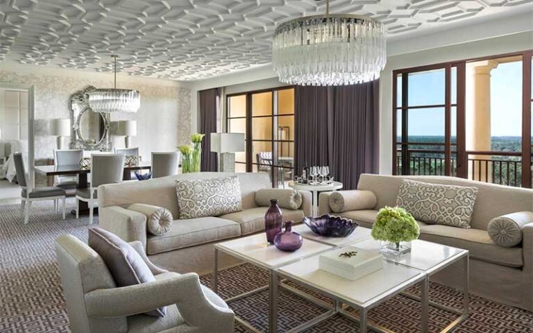 luxury suite with chandelier and views at four seasons resort orlando walt disney world