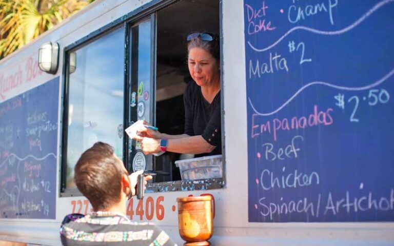 man paying food truck vendor at st pete indie flea