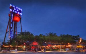night exterior of venue with water tower logo at house of blues restaurant bar at disney springs orlando