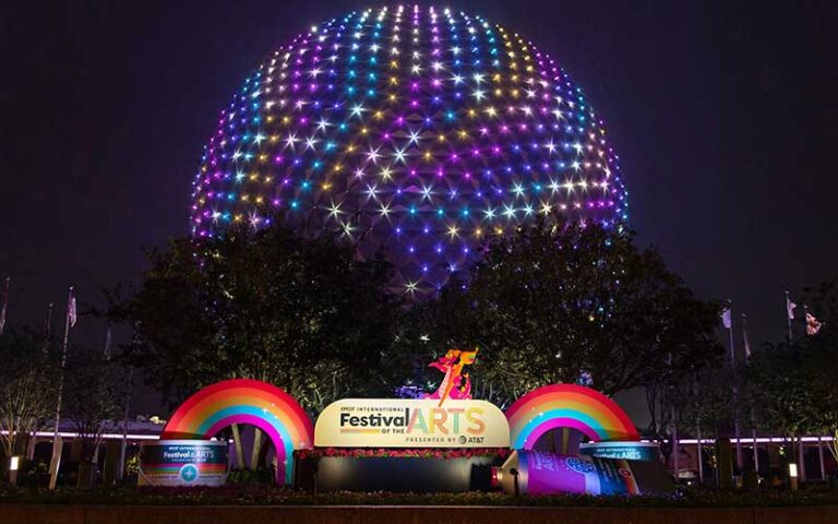 night view of arts festival sign with stars lighted on spaceship earth at epcot walt disney world resort orlando
