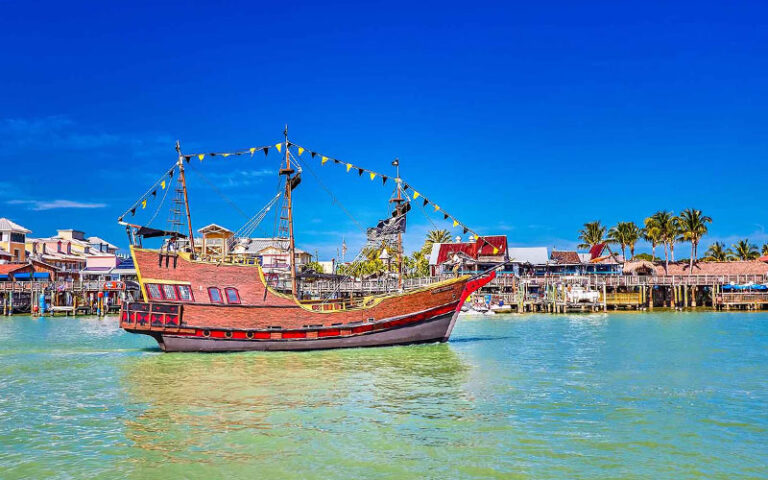 pirate ship moored with boardwalk area behind at johns pass village boardwalk madeira beach