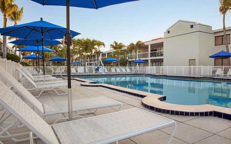 pool area with hotel rooms at the beachcomber st pete beach