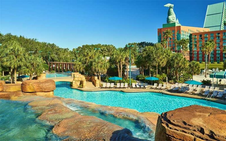 pool and waterfall area with loungers at walt disney world dolphin resort orlando