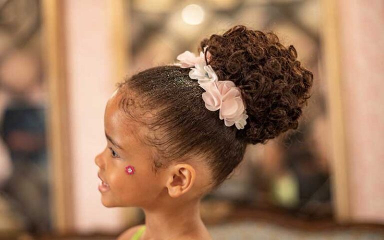 profile of young girl with fancy hairstyle updo at bibbidi bobbidi boutique at magic kingdom walt disney world resort orlando