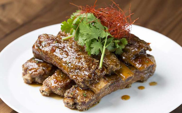 racks of sticky ribs plated at morimoto asia at disney springs orlando