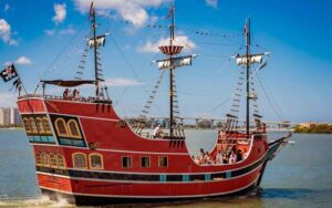 red and black period galleon ship in bay at captain memos pirate cruise clearwater