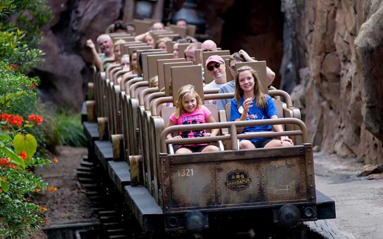 riders seated on coaster on expedition everest legend of the forbidden mountain at animal kingdom walt disney world resort orlando