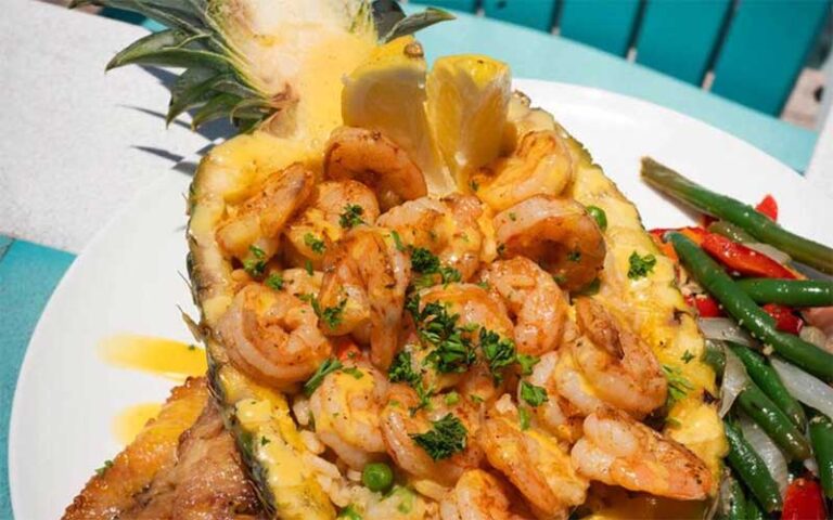 shrimp entree served in half pineapple at seabreeze island grill st pete clearwater
