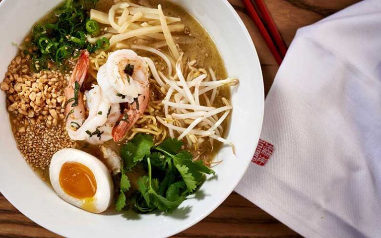 shrimp ramen with egg and logo napkin at morimoto asia at disney springs orlando