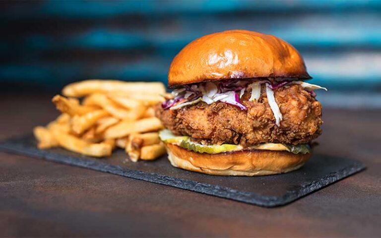 stacked chicken sandwich with fries entree at house of blues restaurant bar at disney springs orlando