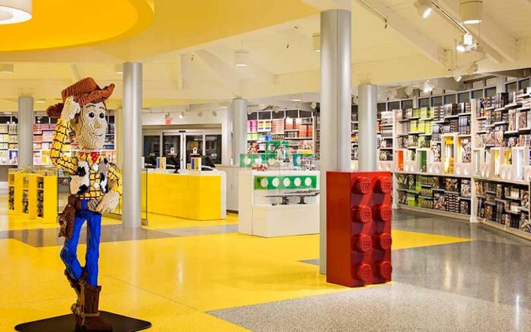 store interior with woody statue at the lego store at disney springs orlando