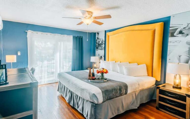 stylish king bed guestroom with balcony at hollander hotel st pete