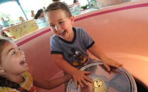 two kids riding on mad tea party at magic kingdom walt disney world resort orlando