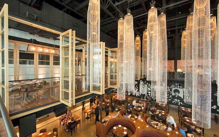 view from loft of dining area with long beaded chandeliers at morimoto asia at disney springs orlando