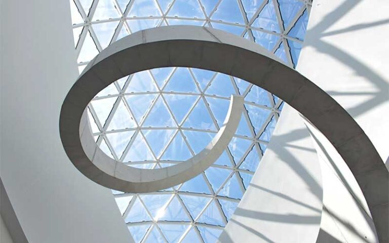 view looking up at atrium with spiraling metal sculpture at salvador dali museum st pete
