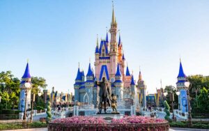 walt and mickey statue with cinderella castle behind at magic kingdom walt disney world resort orlando