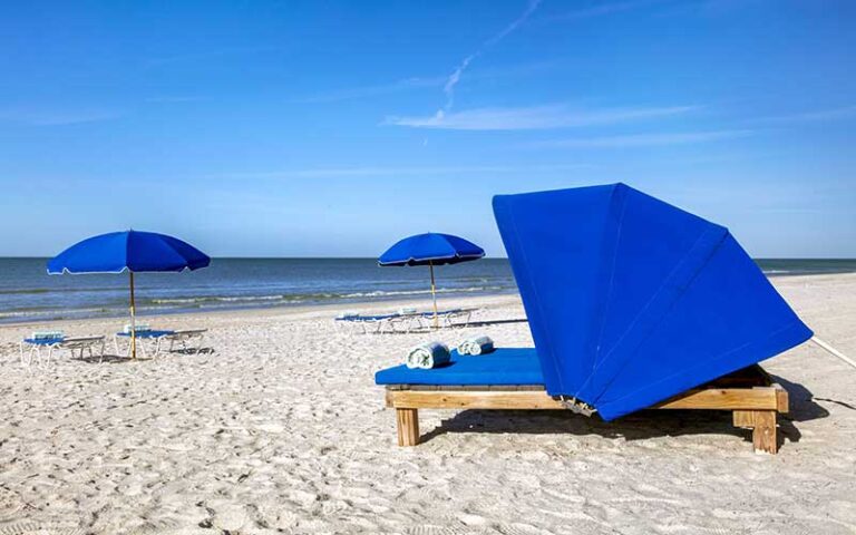 white sand beach with loungers at the beachcomber st pete beach