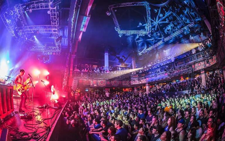 wide angle view of concert with stage and crowd at house of blues restaurant bar at disney springs orlando