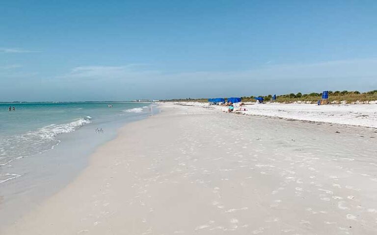 wide expanse of white sand and aqua water at clearwater beach