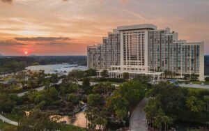aerial view of high rise hotel with water features and sunset at hyatt regency grand cypress resort orlando